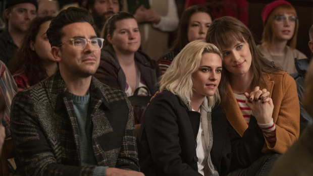 Dan Levy, Kristen Stewart (middle) and Mackenzie Davis stars in the Christmas rom-com Happiest Season. 