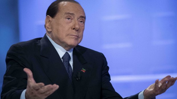 Former Italian Premier Silvio Berlusconi gestures as he attends a TV show in Rome, in February.