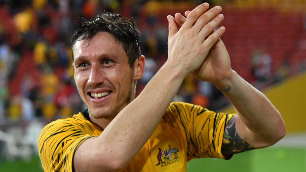 Proud moment: Mark Milligan thanks the Brisbane crowd after the Socceroos snatched a draw against South Korea.