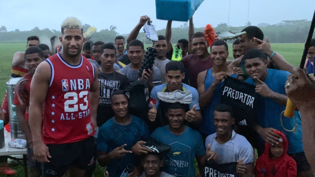 Giving back: Viliame Kikau delivers playing gear to a rugby club in Fiji.