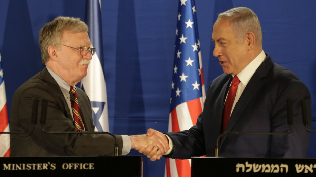 Israeli Prime Minister Benjamin Netanyahu, right, shakes hands with US National Security Adviser John Bolton during a joint statement to the media following their meeting in Jerusalem on Sunday.