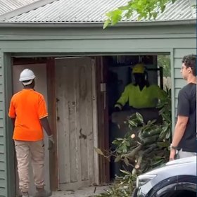 Marco Fanuli oversees the shredding of the tree branches.