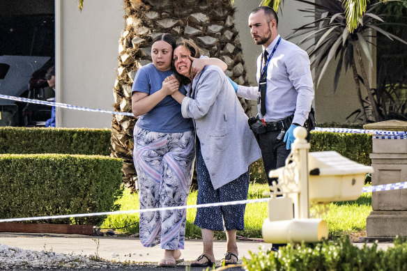 Grieving family members outside the Greenvale home where John Latorre was shot dead.