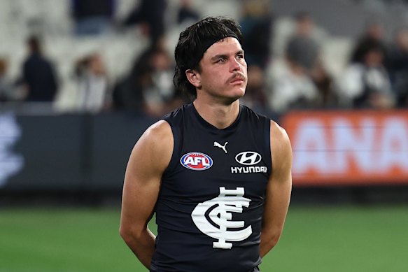 Elijah Hollands cut a lonely figure after the loss to the Magpies on Thursday night.