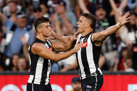 Magpies Nick Daicos and Ash Johnson last season.