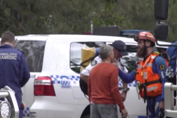 Search and rescue workers at Belmore Falls after a woman in her 20s fell.