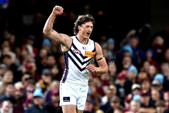 Jye Amiss of the Dockers
celebrates after kicking a goal.