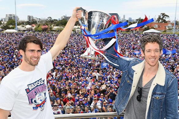 Easton Wood and Robert Murphy with the premiership cup the day after the Western Bulldogs’ 2016 grand final win.