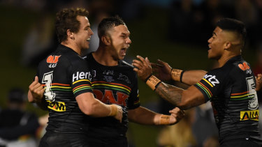 On a roll: Dylan Edwards, left, celebrates his try with Brent Naden, centre, and Brian To'o.