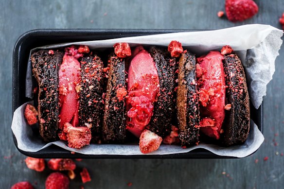 Brownie rounds sandwiching raspberry sorbet.
