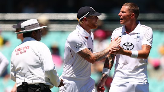 Stokes pushes away Carse before having words with the on-field umpire.