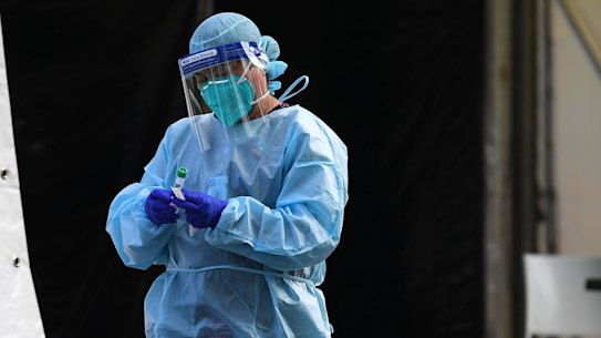 A medical professional conducting tests for COVID-19.