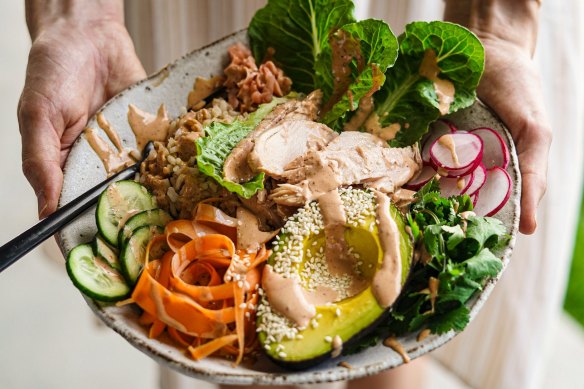 This spicy tuna roll bowl has a filling brown rice base, and unsaturated fats from avocado.