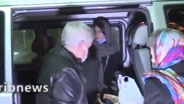Australian academic Kylie Moore-Gilbert, centre inside van, is seen in Tehran, Iran before being released. 