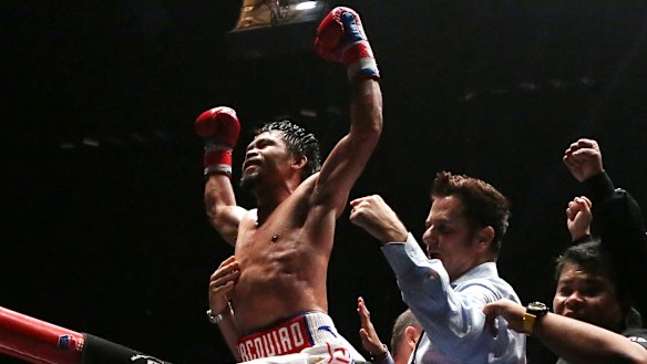 He's back: Manny Pacquiao celebrates his seventh-round knockout.