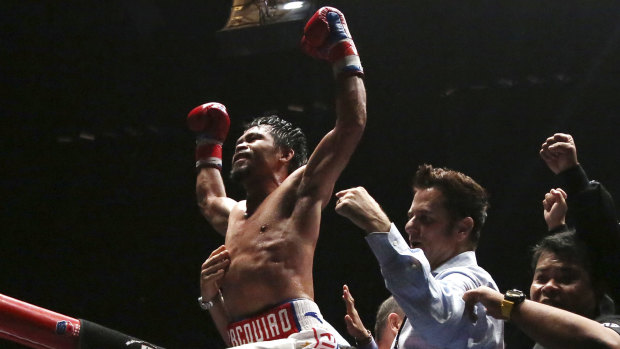 He's back: Manny Pacquiao celebrates his seventh-round knockout.