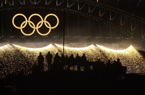 Fireworks erupt along the Harbour Bridge to mark the closing of the 2000 Summer Olympics.