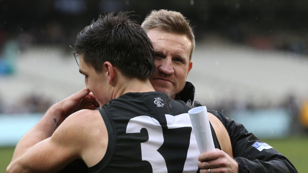 Maynard shares a hug with coach Nathan Buckley.