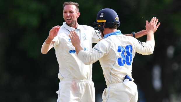 NSW paceman Trent Copeland (left) celebrates with Daniel Solway after taking a wicket earlier this season.