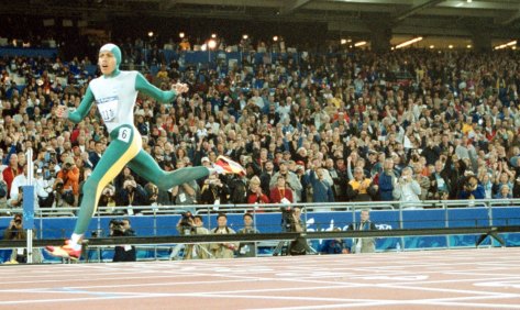 Cathy Freeman crosses the line to win gold at the Sydney 2000 Olympics.