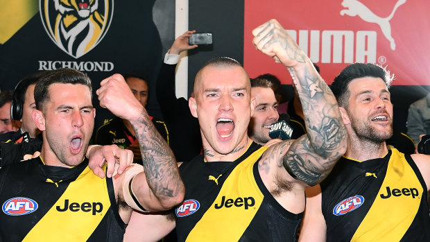 Jack Graham (left) with Dustin Martin and Trent Cotchin, after the Tigers beat the Cats in last week's preliminary final. 