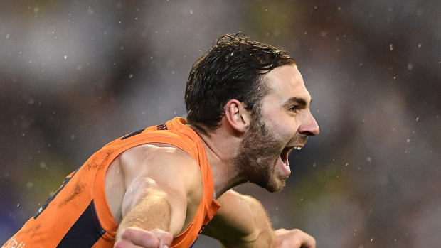 Flying: Jeremy Finlayson of the Giants celebrates kicking a crucial goal at the MCG.