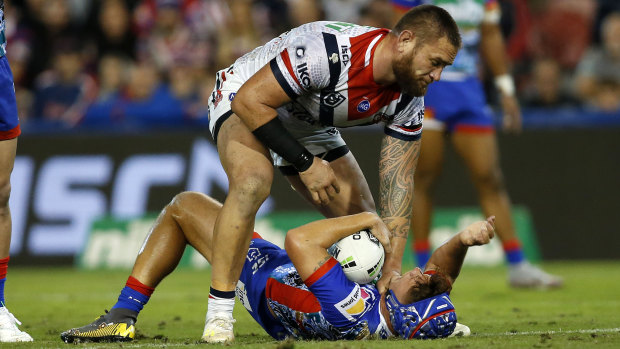 Jared Waerea-Hargreaves holds down Kalyn Ponga after the dubious tackle.