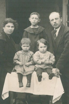 Phillip (sitting front left) with his family at his grandma’s house in the early 1920s. 