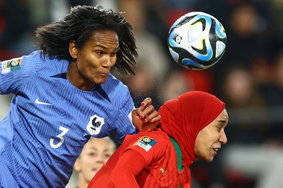 Morocco’s Nouhaila Benzina in action with France’s Wendie.