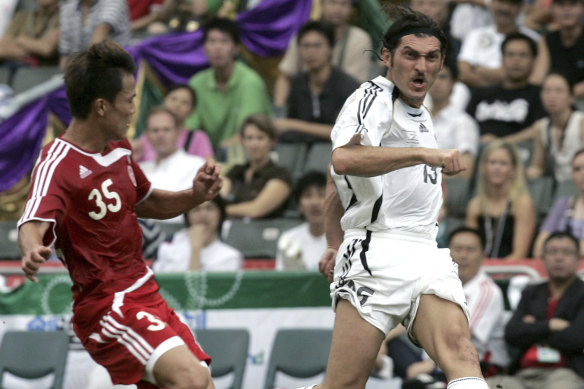 Mikheil Kavelashvili, right, in action against the Chinese national team in 2007 during the Reunification Cup in Hong Kong.