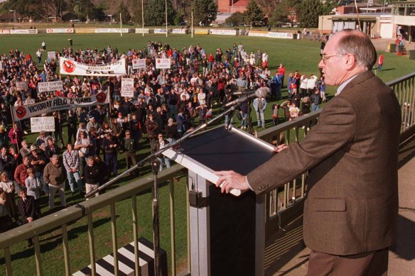 Then Prime Minister John Howard, body armour beneath his suit, addresses a gun rally at Sale, Victoria, in 1996.