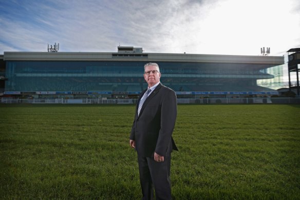 Former Glen Eira mayor Jim Magee poses at Caulfield Racecourse in 2015.