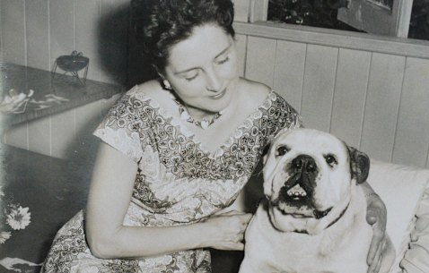 Joy Christensen as a younger woman with her bulldog, Bullie.