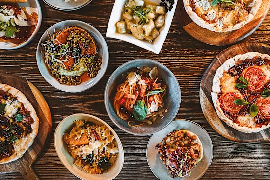 The menu leans Italian with pizza and pasta at Shedshaker.