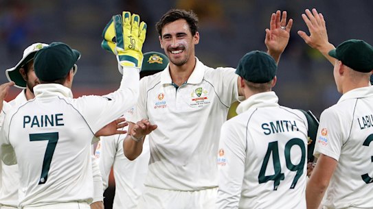 Mitchell Starc's Australian teammates celebrate after the quick dismissed Neil Wagner.