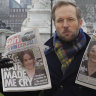 Royal coverage is a core part of British media, as shown by a reporter holding front pages in 2021 outside Buckingham Palace.