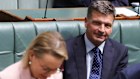 Angus Taylor looks on as Opposition Leader Sussan Ley takes her seat for question time on Monday.