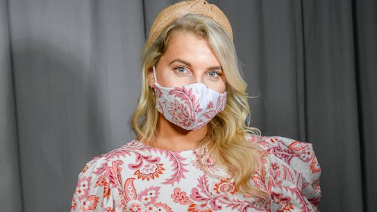 Model Lauren Steiner wears a dress and matching mask from designer Julia Torrance Hemingway. 