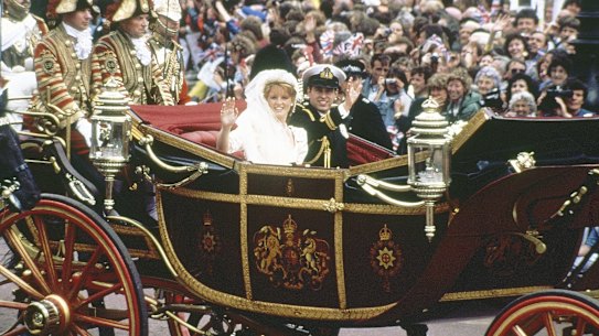 Then-prince Andrew and his bride Sarah Ferguson greet the waiting crowds from their carriage as they leave Westminster Abbey in London on their wedding day in 1986.