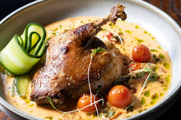 Red curry duck leg with pickled cucumber.
