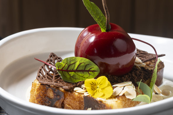 Brunch dishes include a brioche French toast with biscuit leaves topped with a chocolate cherry filled with cream and cherry compote.
