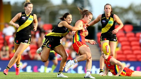 Jamie Stanton, centre, is tackled. 