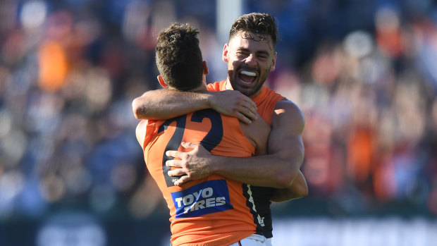 Stephen Coniglio (right) and Josh Kelly of the Giants react after the final siren.