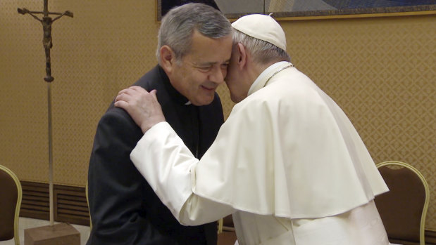 Juan Barros, Bishop of Osornos, greets Pope Francis on Friday.