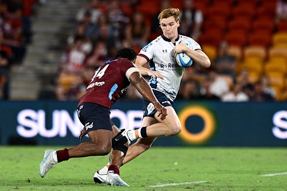 Jimmy Hendren tries to get around a Reds defender.