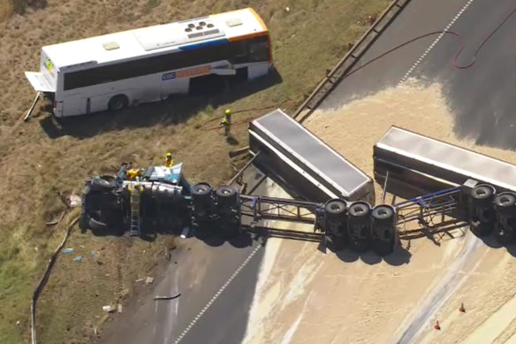 A truck rolled onto its side, spilling sand onto the Princes Freeway.