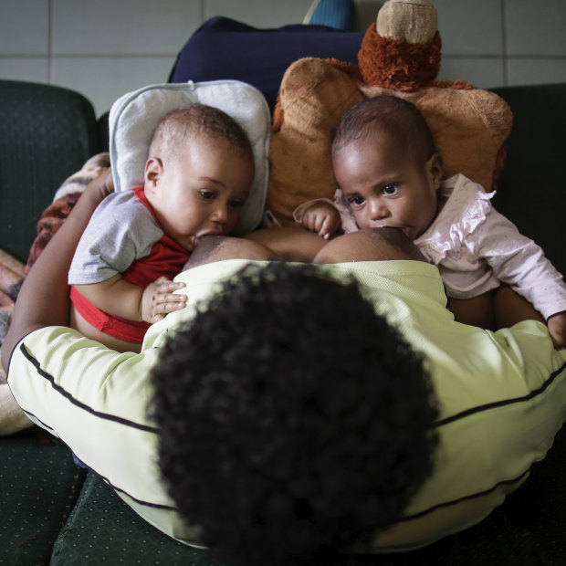 Susu Mamas midwife Sylvia Nikints breastfeeds her five-month-old babies Zita and Zion.