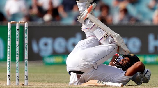 Sri Lankan opening batsman Dimuth Karunaratne has gone to hospital after being struck by a Cummins bouncer.