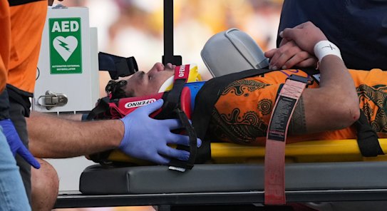 Australia’s Noah Lolesio leaves the field after a heavy tackle against Fiji in Newcastle