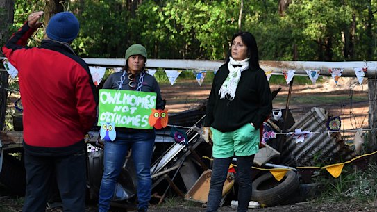 A small group of local residents gathered earlier this month at a barricade blocking the entrance to one of the only unburnt areas of bushland in the region that is now subject to a housing development.